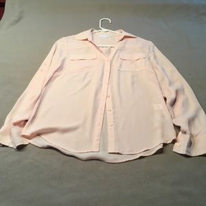Woman’s beautiful peach blouse